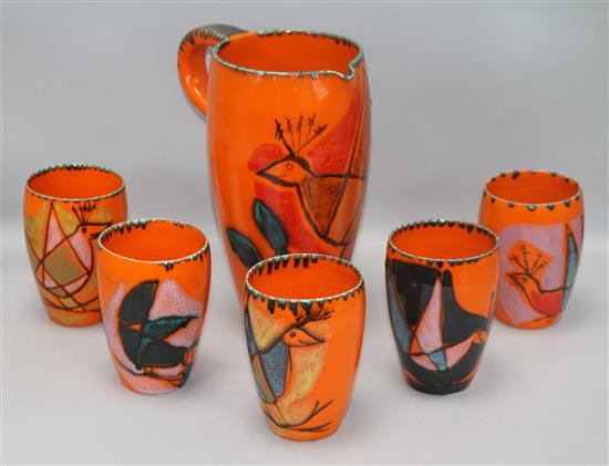 A Vallauris pottery pitcher and five cups